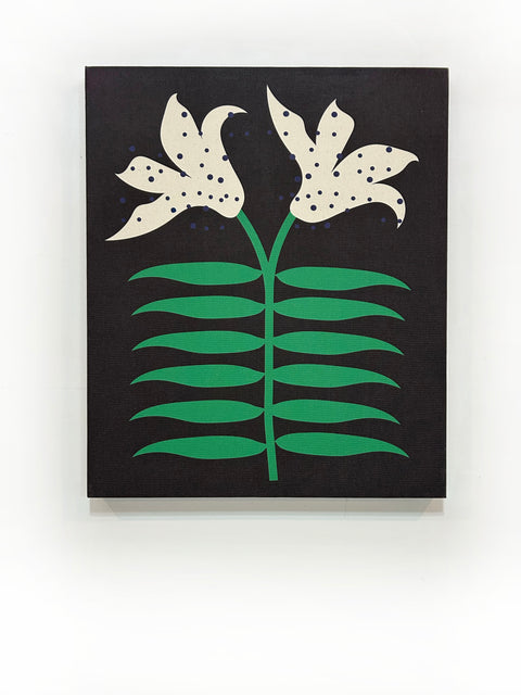 A piece of canvas contemporary art with black background featuring white lily flowers with green leaves and dark blue dots
