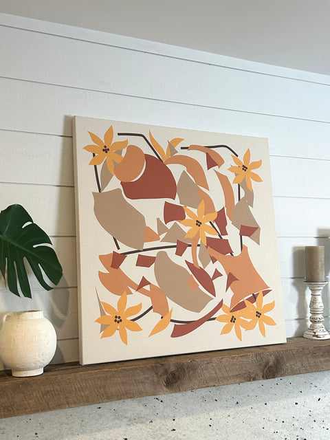 Large abstract floral and geometric art piece with shades of orange and brown in a stylish room