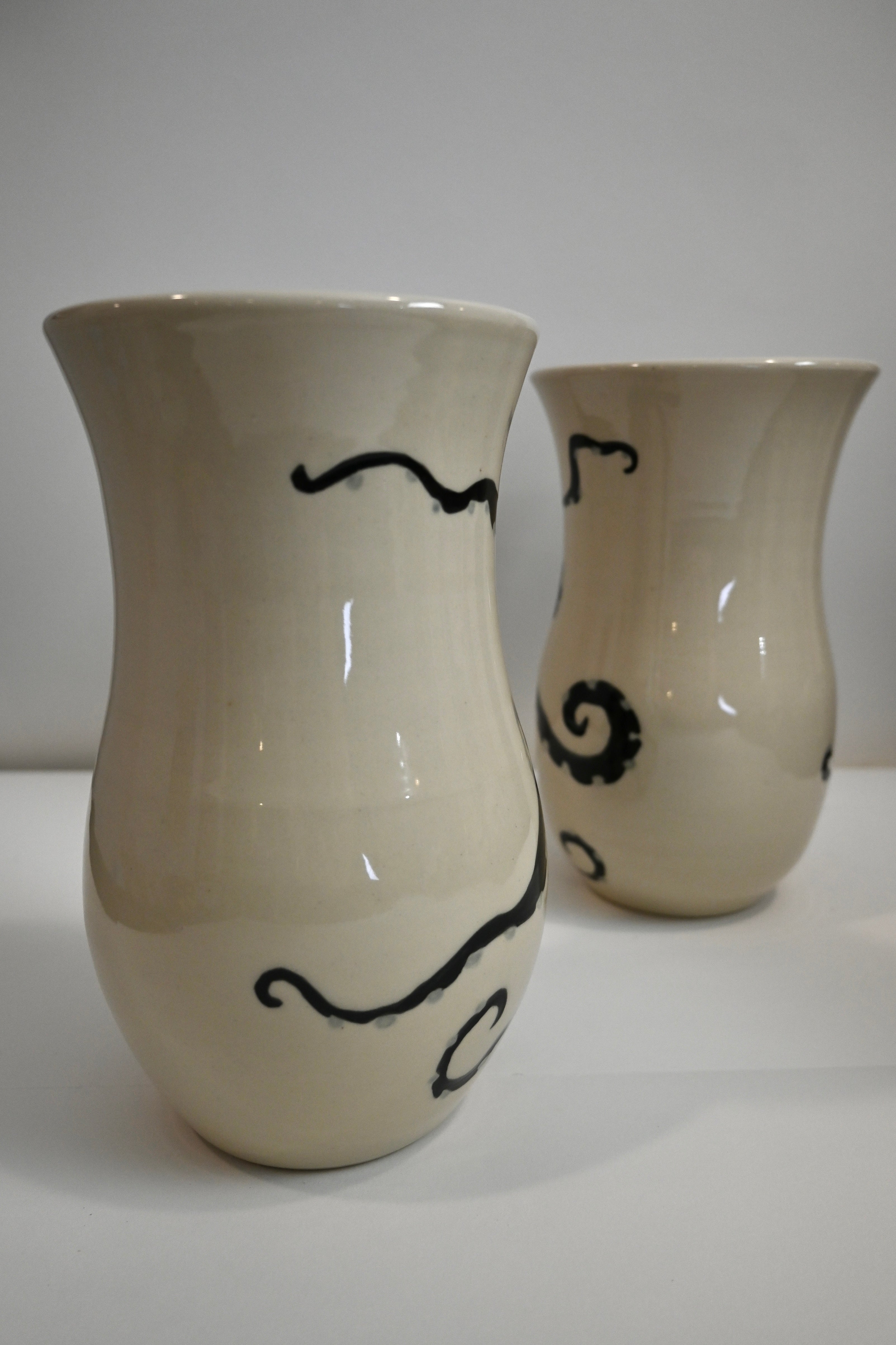 Back of ceramic vase with handpainted octopus design wrapping around it