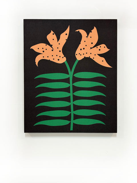 A piece of canvas contemporary art with black background featuring orange lily flowers with green leaves and black dots