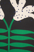 A piece of canvas contemporary art with black background featuring white lily flowers with green leaves and blue dots