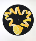 Decorative turnstile slipmat with unique lemon rind design and black background 