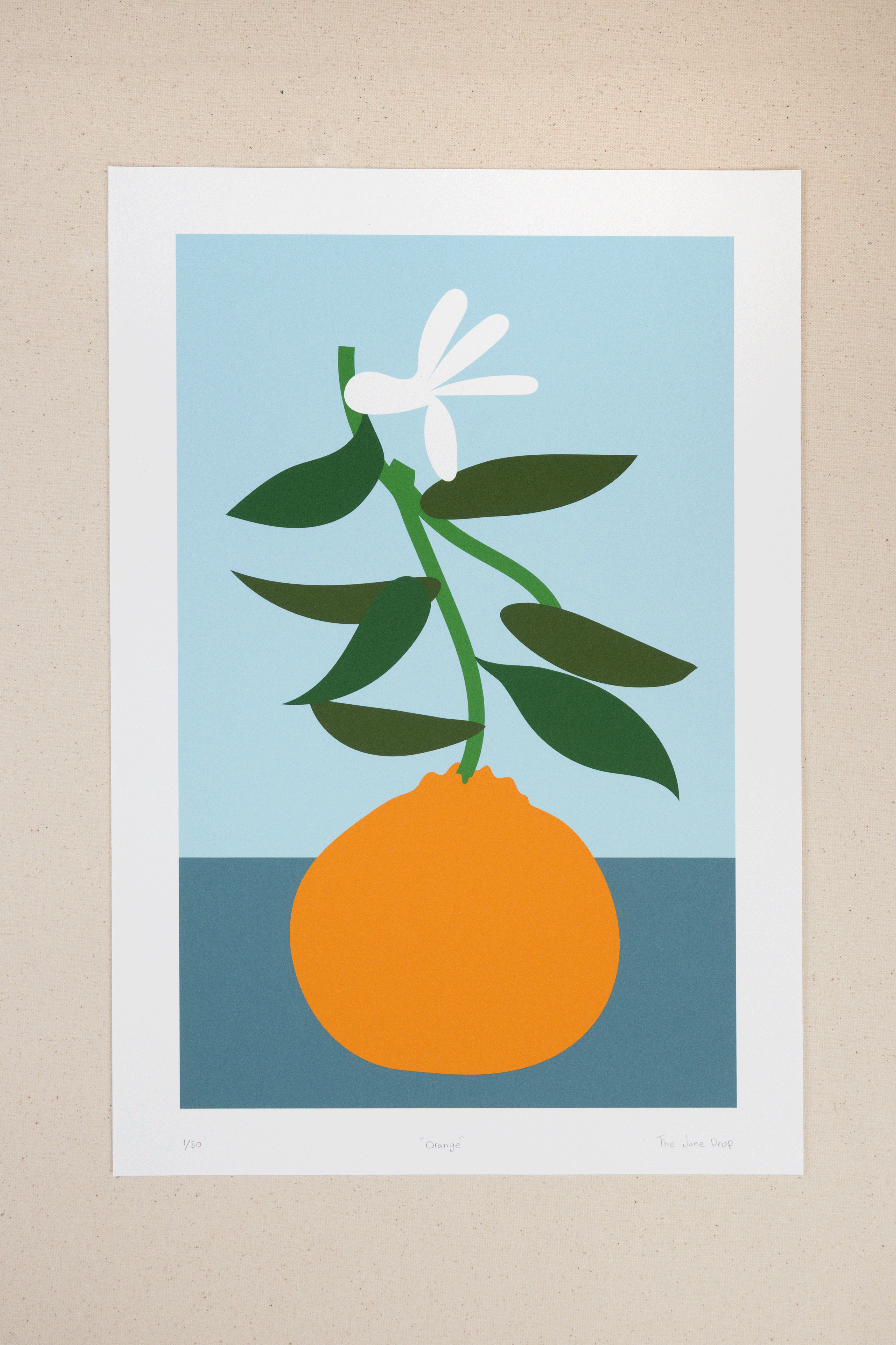 Pop art style orange print with blue background and white flower