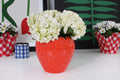 Strawberry shaped ceramic vase with colorful background