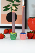 Colorful strawberry-shaped ceramic candle holders, green, pink, yellow, and blue
