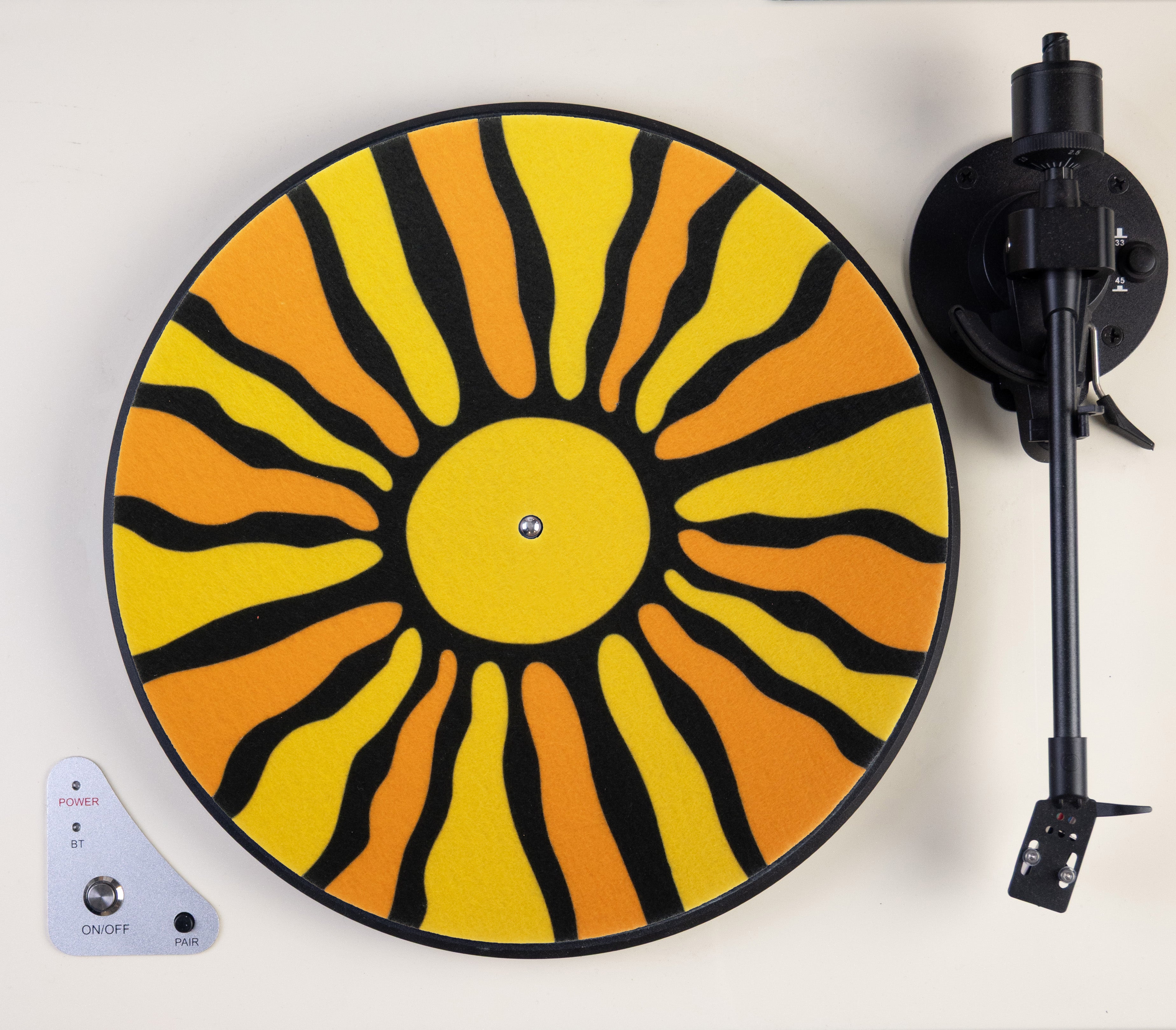 Vinyl record player with a sunburst design  slipmat on a white background