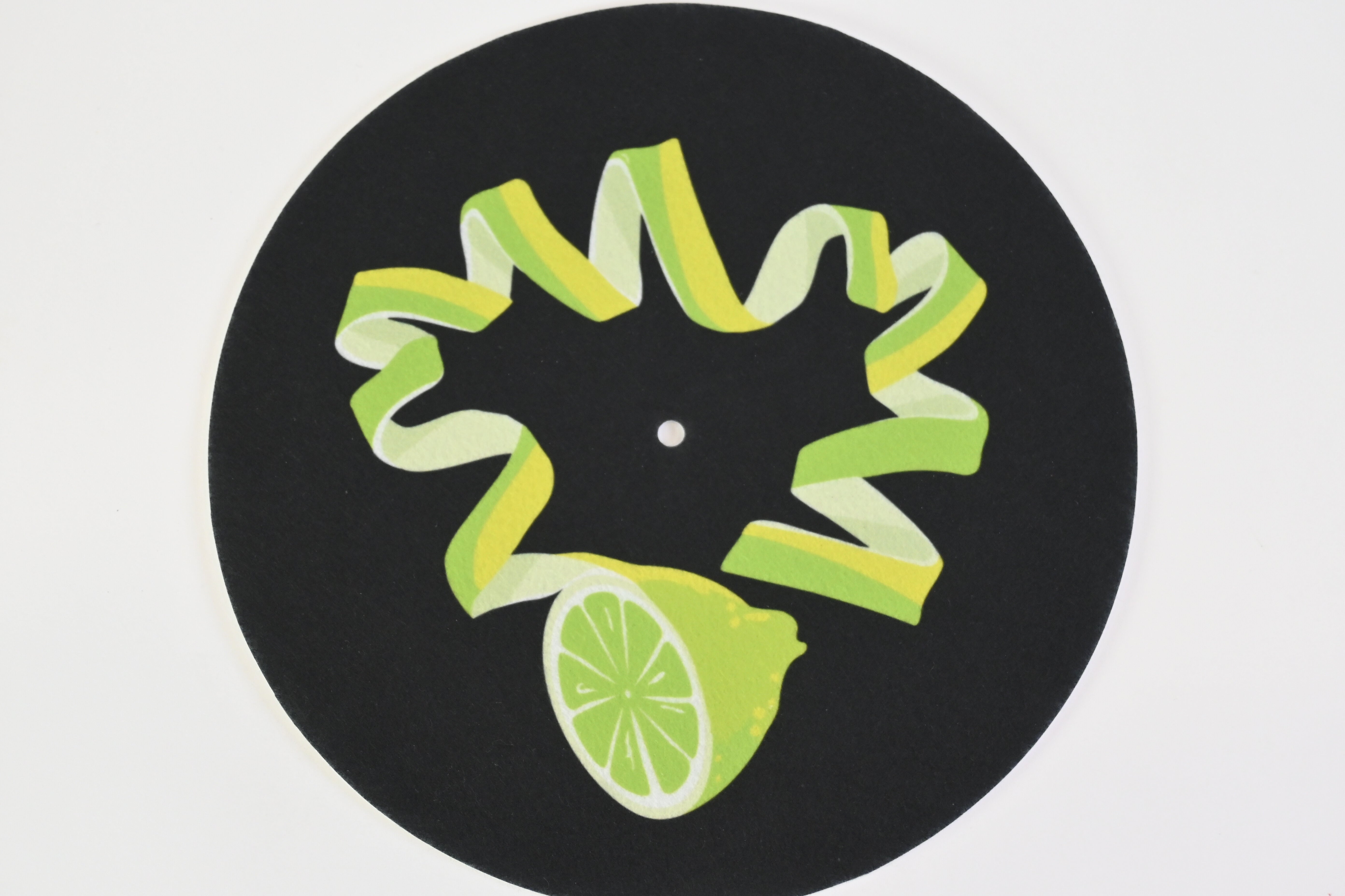 Felt turntable slipmat with unique green lime design on a black background