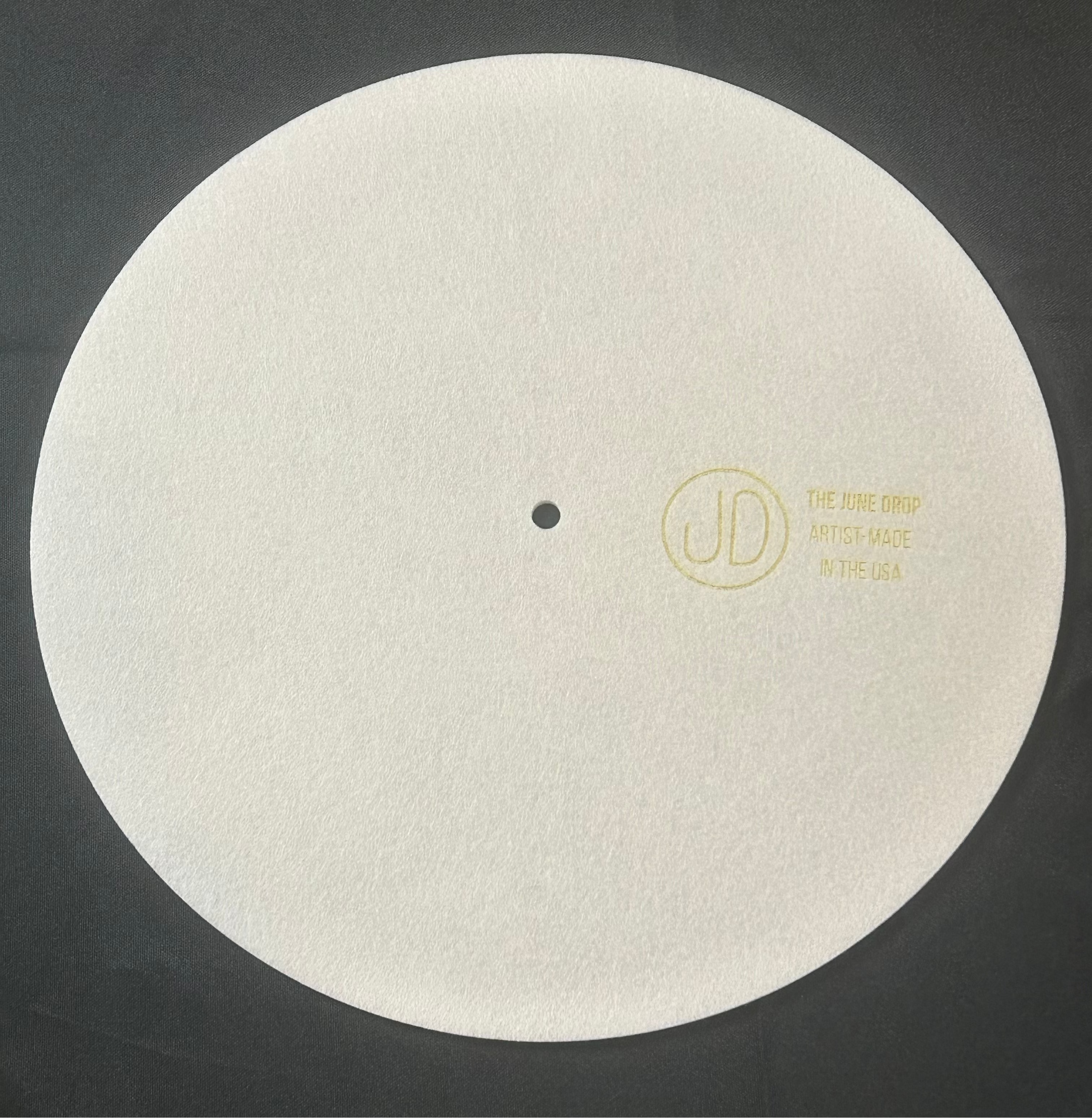 back of slipmat with the june drop artist made in the usa logo on white background