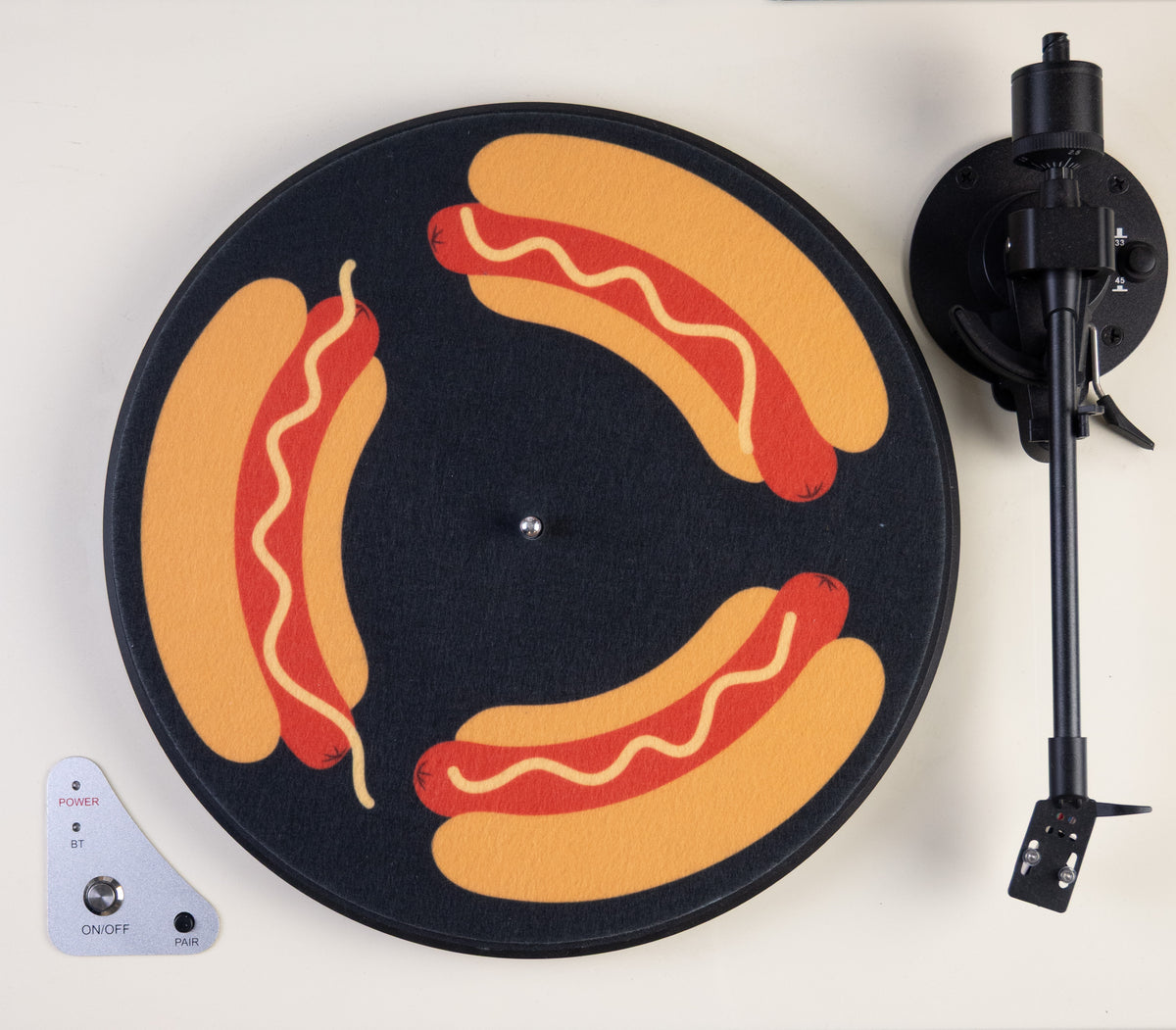 Turntable with a slipmat featuring hot dogs and mustard design 
